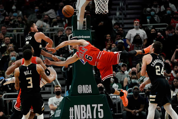 Chicago guard Alex Caruso will miss four-to-six weeks with a fractured wrist after taking this hard foul from Grayson Allen (far left).